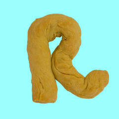 The letter "R" made from pastry, which can be eaten.