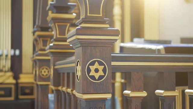 Star of David, Jewish symbol on wood in synagogue in sunlight,