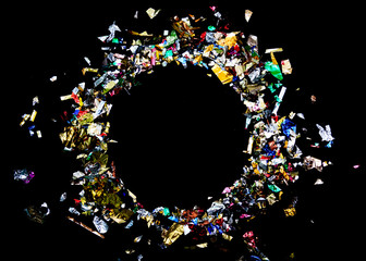 Colorful celebration background with party confetti on a black background.