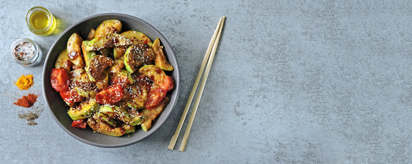 Stewed zucchini with soy sauce and sesame. Squash in Chinese style.