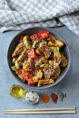 Stewed zucchini with soy sauce and sesame. Squash in Chinese style.