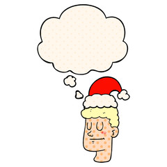 cartoon man wearing christmas hat and thought bubble in comic book style