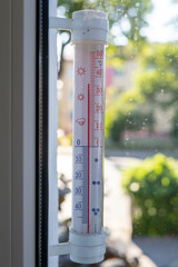Thermometer indicating high temperature. Heat in the city is a threat to residents.