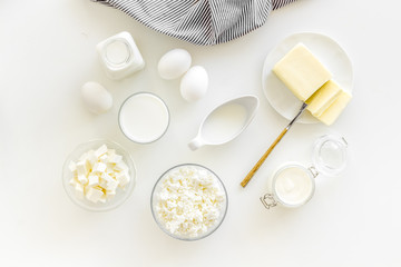 Eggs, butter, milk, yougurt, cottage for natural farm products yougurt on white background top view monochrome pattern