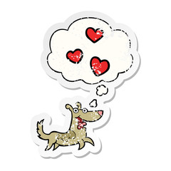 cartoon dog with love hearts and thought bubble as a distressed worn sticker
