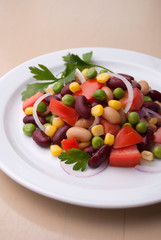 Healthy bean and corn salad on a white plate