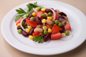Healthy bean and corn salad on a white plate