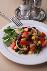 Healthy bean and corn salad on a white plate