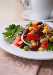 Healthy bean and corn salad on a white plate