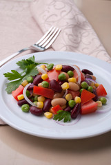 Healthy bean and corn salad on a white plate