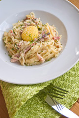Traditional Italian pasta carbonara with bacon, egg yolk, cheese.