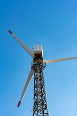 The wind turbine power working, blue sky, energy power concept