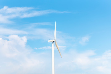 The wind turbine power working, blue sky, energy power concept