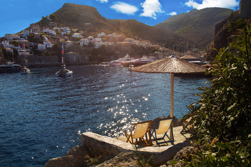 Fototapeta premium View of the sunbathing area and harbor of Hydra- greek island