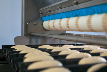Dessert bread baking in oven. Production oven at the bakery. Manufacture of bread. - 276017506
