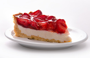 delicate strawberry cheesecake on a white plate. macro