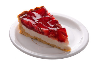 delicate strawberry cheesecake on a white plate. macro