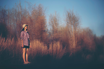 women standing alone with nature