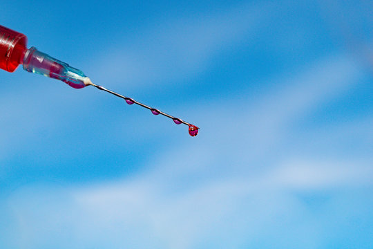 Type of medical syringe with red liquid