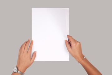 Person holding white empty paper