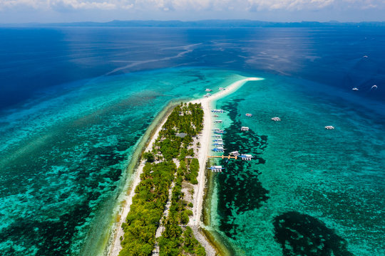 Aerial drone view of a beautiful tropical island surrounded by coral reef (Kalanggaman Island, Leyte, Philippines)