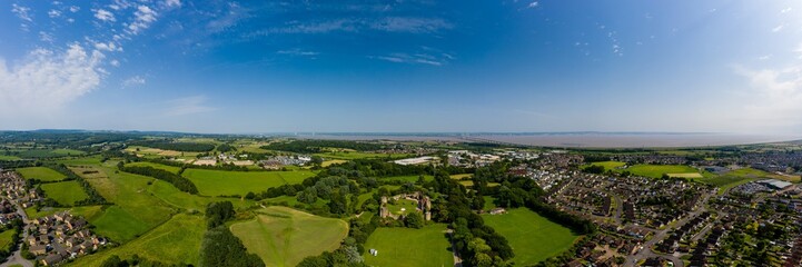 Fototapeta na wymiar Aerial panorama of Caldicot Castle and both Severn Bridges in the background