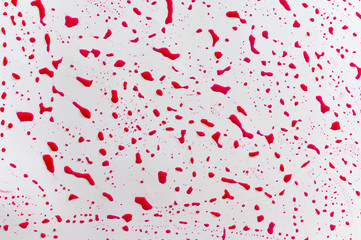 Drips red on a white background. Abstract background.