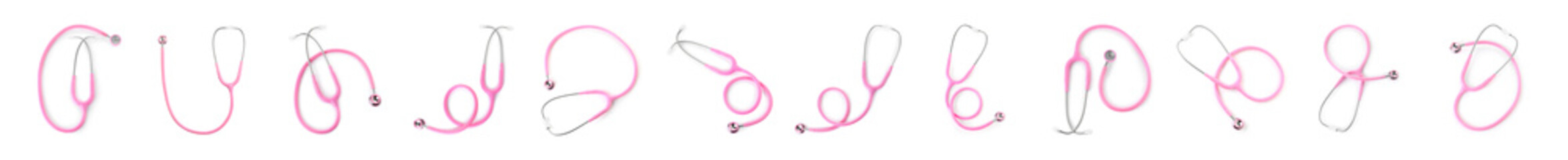 Set of pink stethoscopes on white background, top view. Medical device