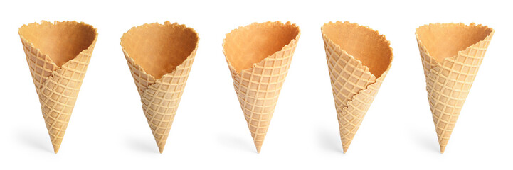 Set of empty crispy wafer ice cream cones on white background. Sweet food