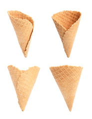 Set of empty crispy wafer ice cream cones on white background. Sweet food