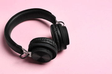 Fototapeta na wymiar Stylish headphones on color background. Space for text