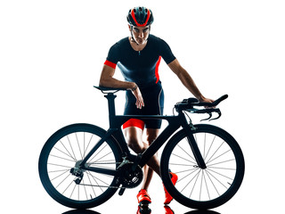 Obraz na płótnie Canvas triathlete triathlon Cyclist cycling in studio silhouette shadow isolated on white background