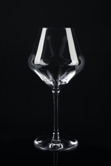 New empty wine glass on black background