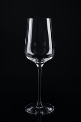 New empty wine glass on black background