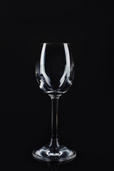 New clean empty glass on black background