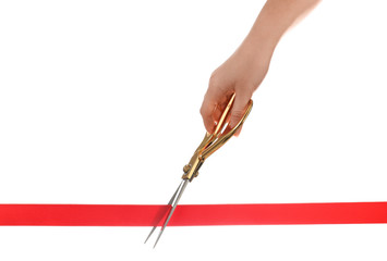 Woman cutting red ribbon with scissors on white background. Traditional ceremony