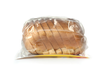 Sliced loaf of wheat bread in plastic bag isolated on white