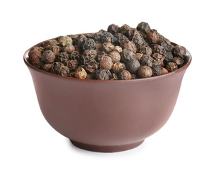 Bowl of black peppercorns isolated on white