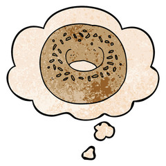 cartoon donut and thought bubble in grunge texture pattern style
