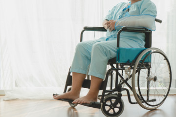 Obraz premium lonely person on a wheelchair after accident injured.