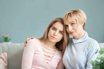 Portrait of mother and daughter at home