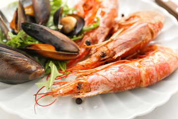 Tasty shrimps with mussels on plate, closeup