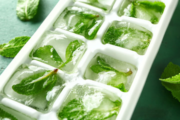 Tray with ice cubes and mint, closeup - Powered by Adobe