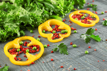 Fresh herbs with vegetables and spices on wooden background