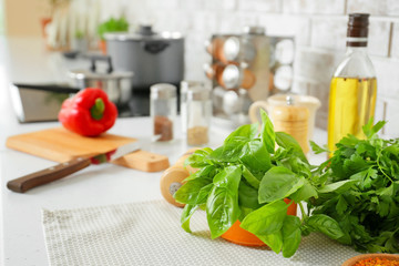 Fresh herbs on table in kitchen