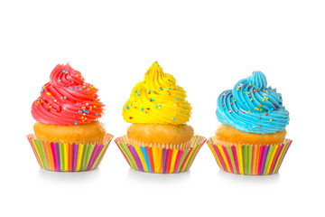 Sweet tasty cupcakes on white background