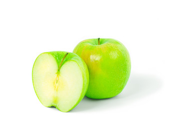Whole green apple and half on white background