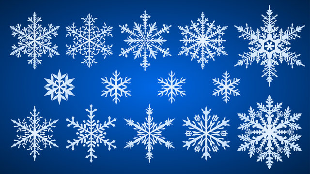 Set of beautiful complex Christmas snowflakes, white on blue background