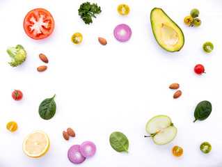 Food background and salad concept with raw ingredients  flat lay on white wooden background.