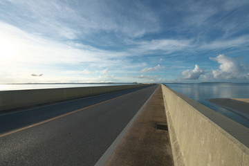 Miyako island, Japan - June 26, 2019: Irabu bridge, the longest charge-free bridge in Japan, connecting Miyako island and Irabu island just after the sunrise